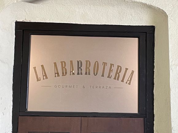 This is above the door to the bedroom and to outside?  La Abarroteria is grocery store.  I haven't asked the owners if these were original.