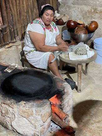 I swear this woman was smiling right before I took this photo.  Making tortillas by hand at Kinich