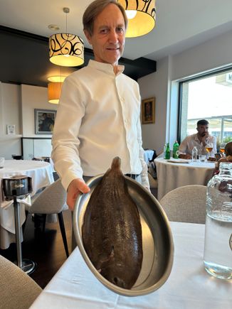 Our courtly and welcoming waiter presenting the lenguado (Dover sole) that we chose to share
