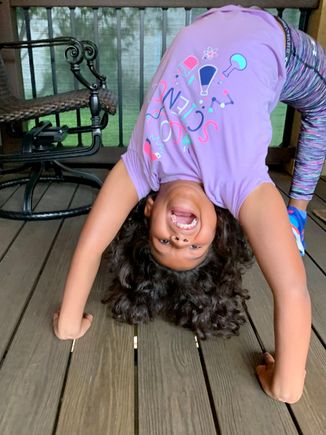 Michaela is into gymnastics big time.