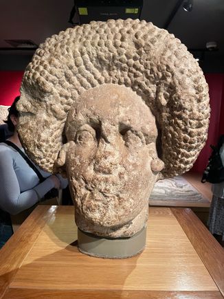 Large bust of woman with the latest hair do...at that time.