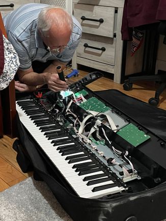 Grandad doing more instrument repair work, this time for one of Adrienne’s friends.