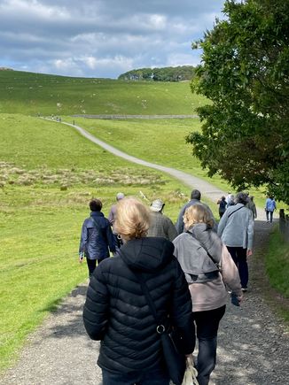 Us, starting up the hill.  We are headed to the trees in the top middle of the picture.  Sure glad I'm not a Roman in armour.