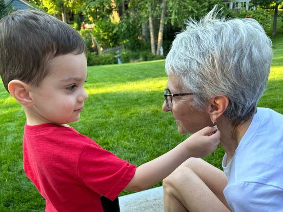 Checking out Joyce’s earrings to make sure they match her outfit. (they always do!!!)