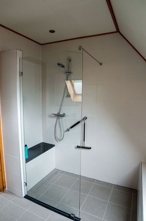 The new shower, with seat and old fogey grab rail.