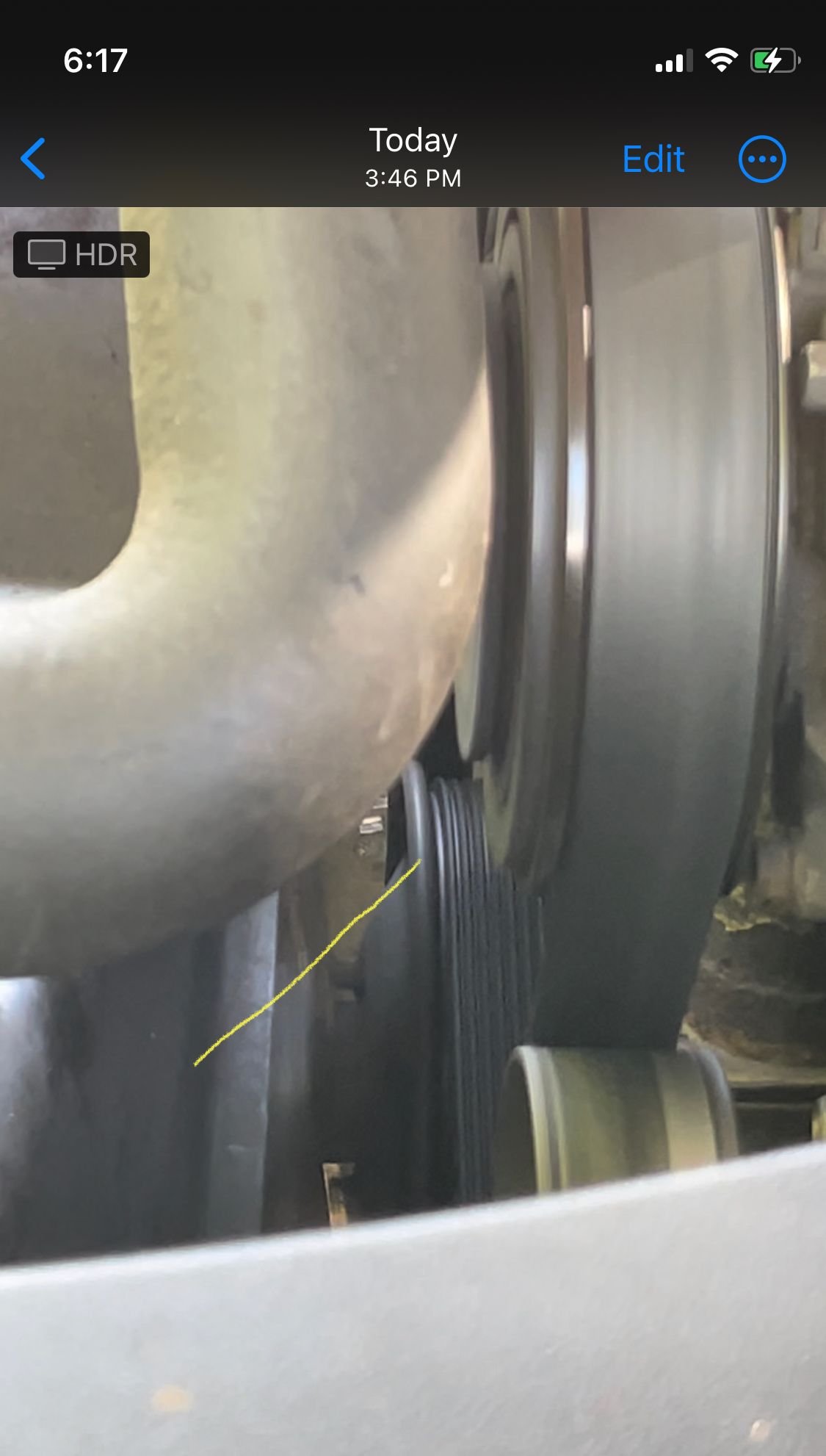 Serpentine belt is bumping into side of radiator pulley and squeaking