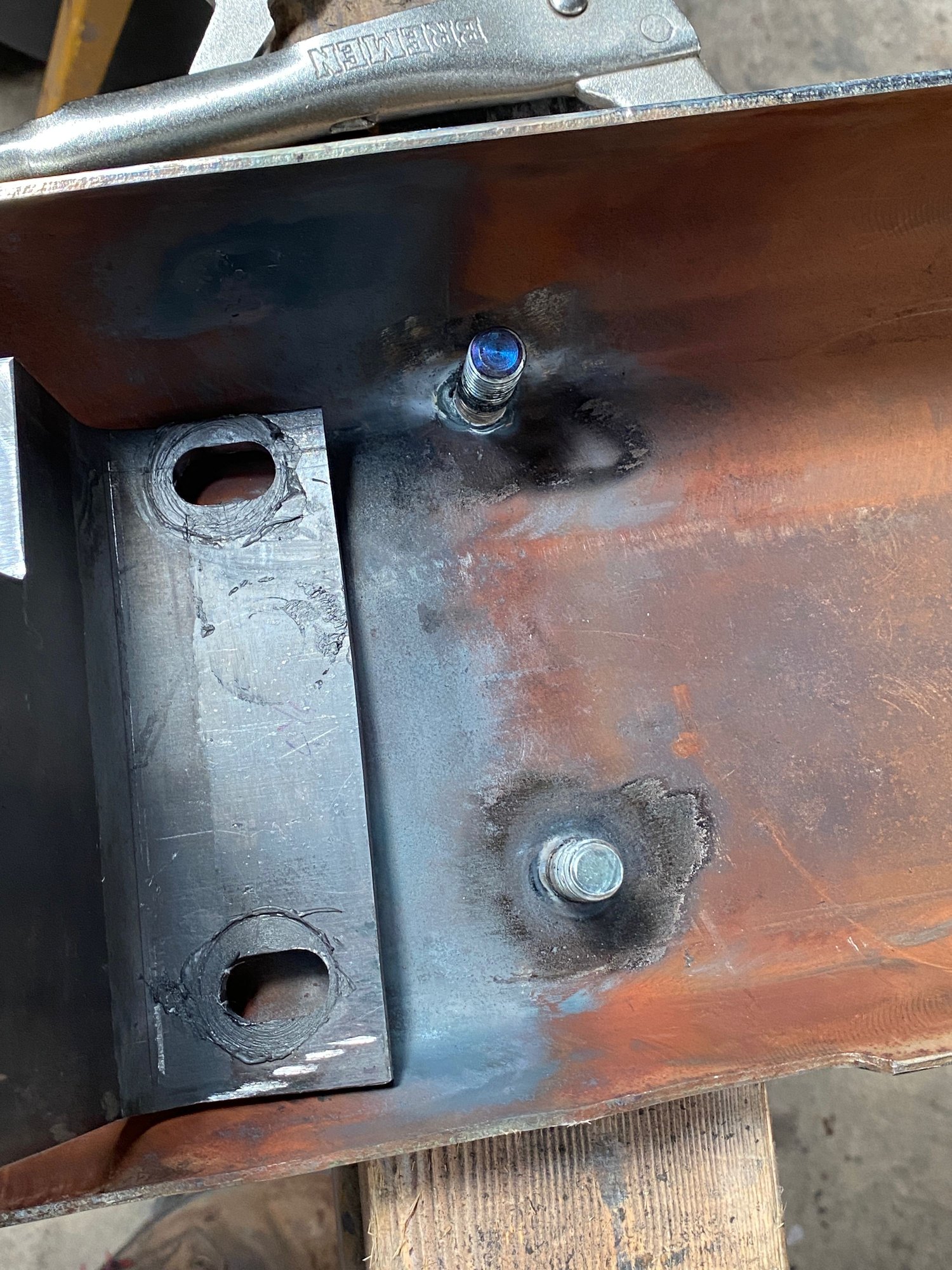 Mounting studs welded in. These are welded from the front. 
