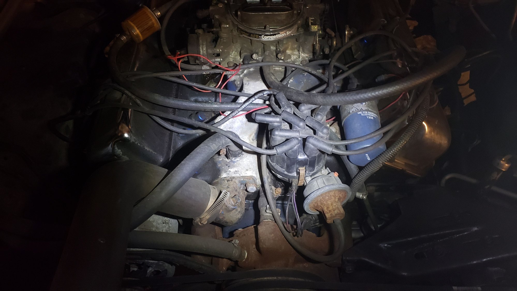 Backfire through carb, only at highway speed after about 10min Ford