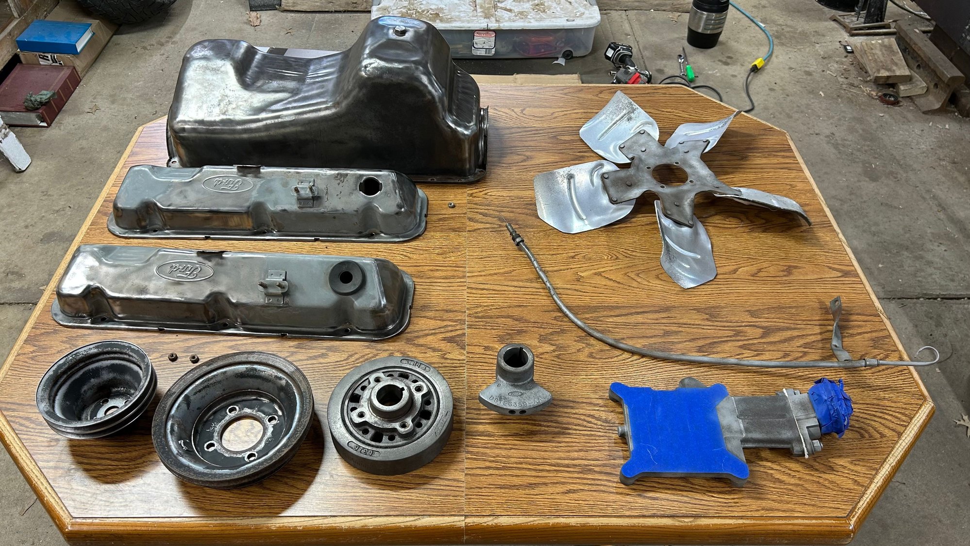 Then I blasted the EGR Valve spacer, the oil, dipstick, and tube, and the center part of the fanblades. I also had to straighten up The dipstick tube and the cap that went up by the hook had come loose and come down so I had to fix it and peen it back on.