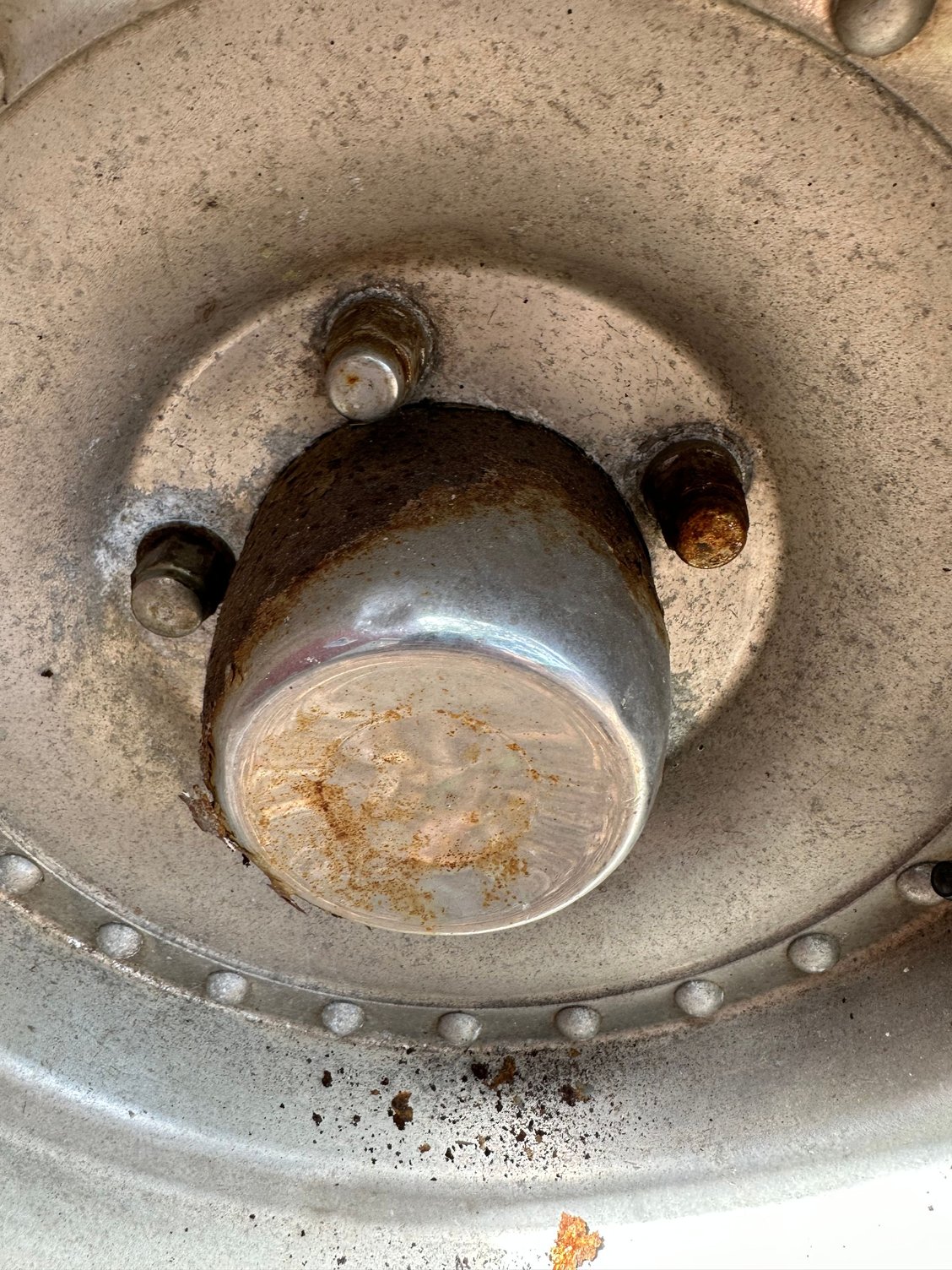 Introducing myself and rusty center hub cap removal question Ford