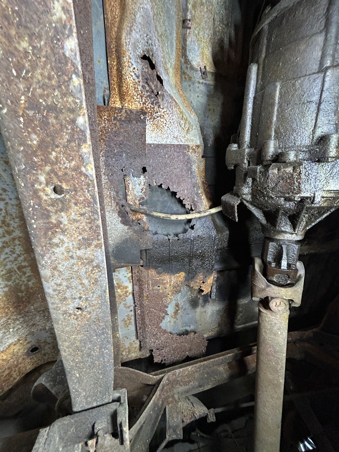 What are these thin sheet metal panels? Thought they were just someone putting some sacrificial metal in for keeping mud off the underside of the floors, but some of them look formed...