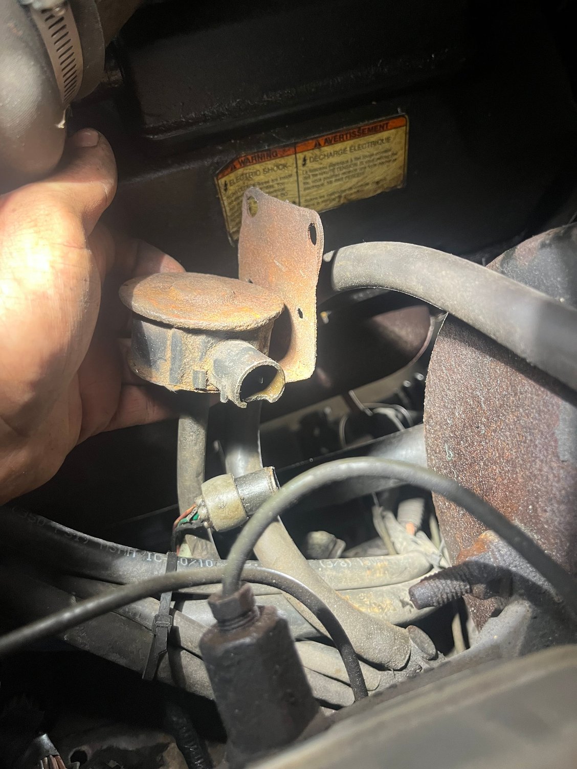 Found this tucked away under the brake booster. What is it and why does it smoke when I plug it back in? 
