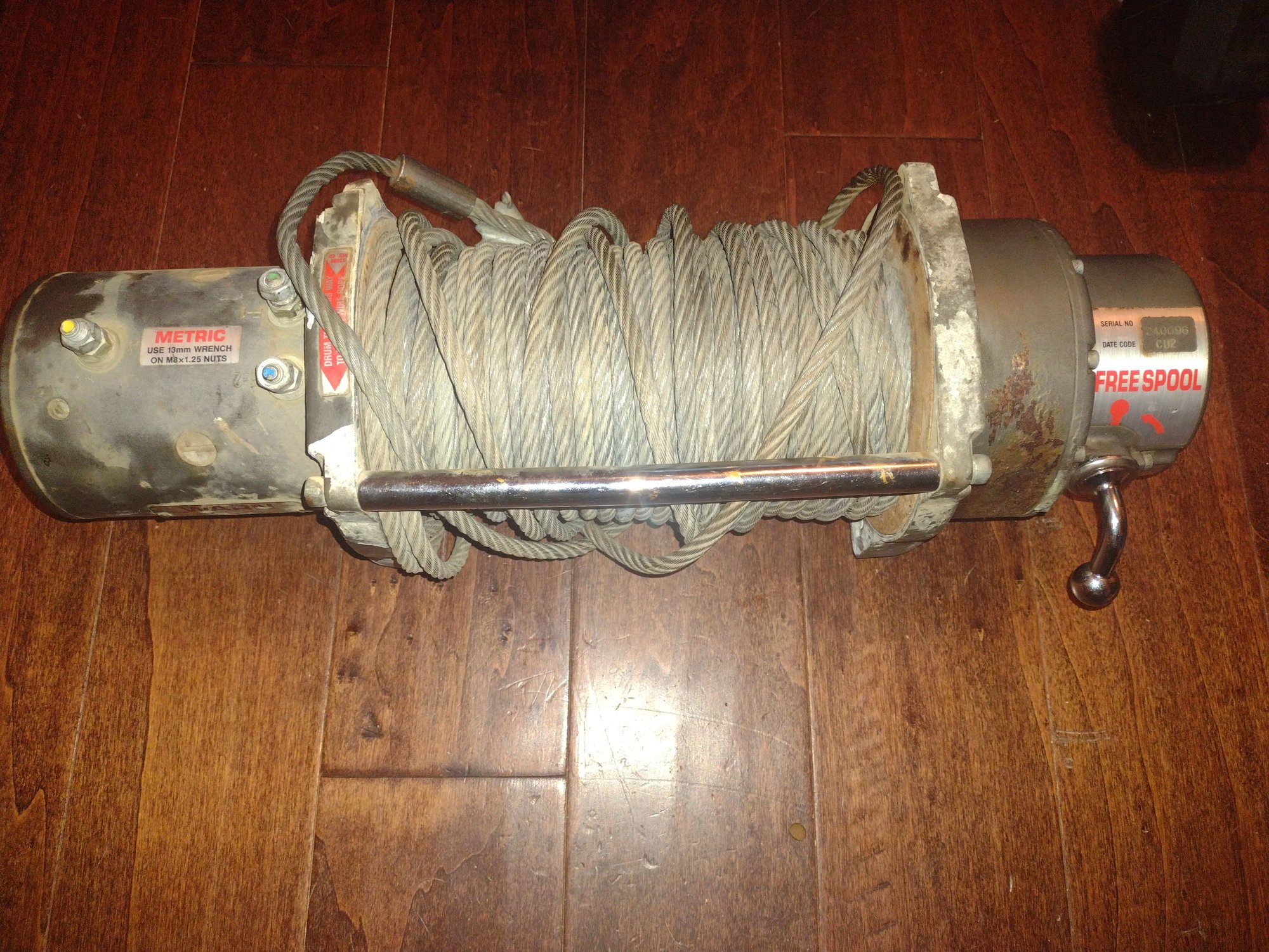 Certainly was a bit rough. The Warn M8000 came with my truck. The corner was already busted, and it only had one bent, ground down, steel tie rod.