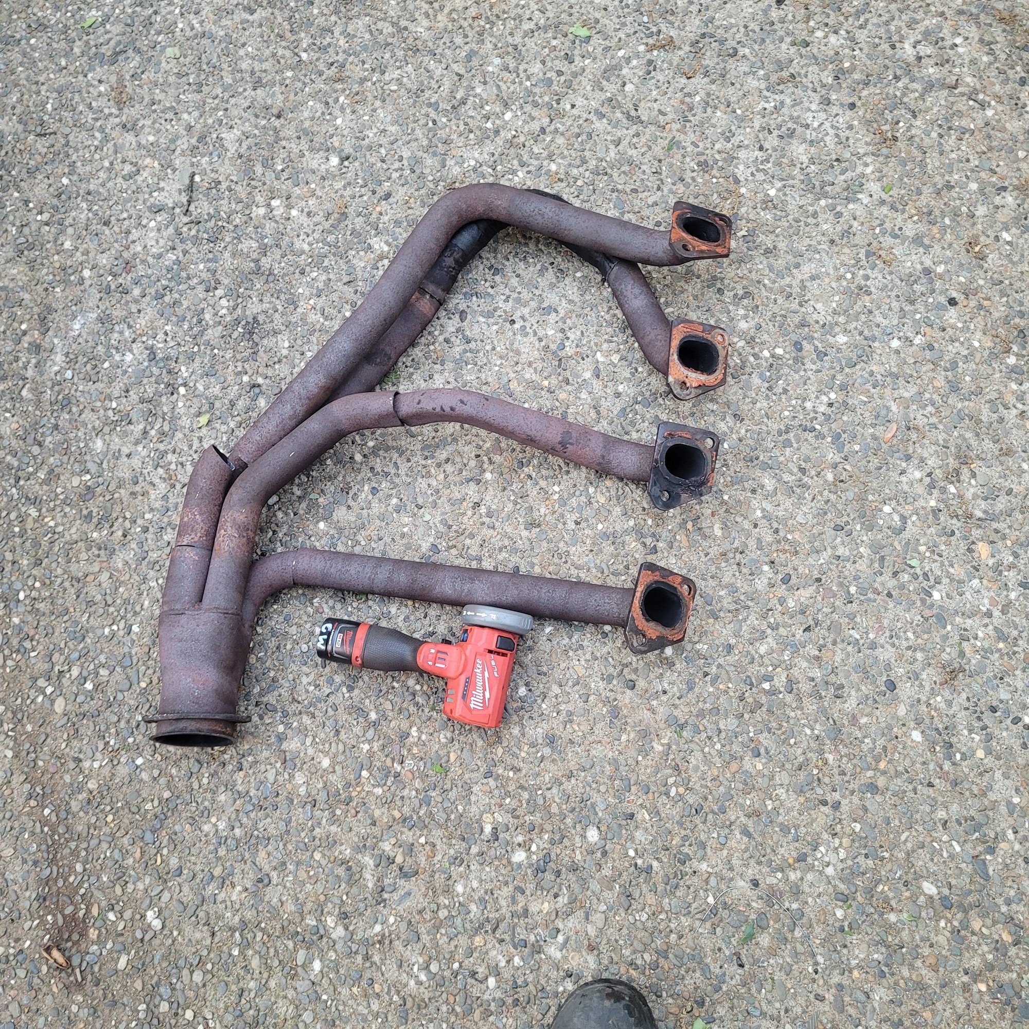 Ended up cutting each individual pipe and mounting each one to the heads to give myself enough exhaust to keep the flames off the engine bay and allow me to drive around the property again and a short test run.