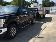 2017 24' PJ flat deck w/ 7k torsion axles, elec over hyd discs, g-rated tires, & hydraulic jacks. 4700# empty. The cargo weight on this load is about 8500#.