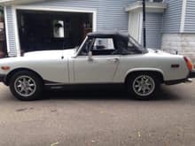 My 79 MG Midget. Lives at my dads house. i built the 1.3 into a high comp 1366cc with cast Alum. head, header, and mini intake manifold with Weber carb. My only "nice" car.