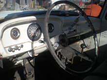 THE INTERIOR WITH THE MANUAL CHOKE IN THE CAB AND THE RADIO, AND THEY BOTH STILL WORK. I LOVE IT