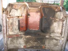 F250 Cab underside before sandblasting. Some original undercoating removed to reveal still intact red primer. Underside of floor pans in perfect condition. Top side another story.
