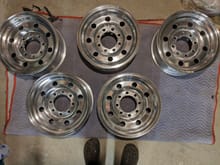 Four original, one from junk yard. Turned and rebalanced with polished aluminum face sealed with AlumaShield coating. Used a two-part clear urethan on wheel barrel and wheel bead area. Five new Michelin Agilis CrossClimate LT235/85R 16E all weather radial tires installed.