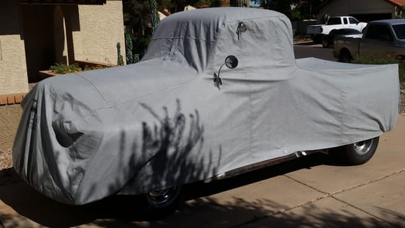 A California Car Cover.  I need to sew on the mirror pockets... Which is going to be fun since I have 3 and want to add another wink mirror on top of the passenger door just above the window divider channel.