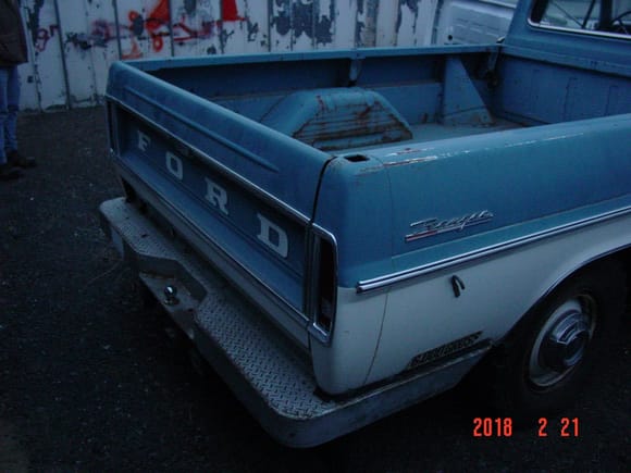 I think the tailgate was stored while the camper was on, it looks too new.