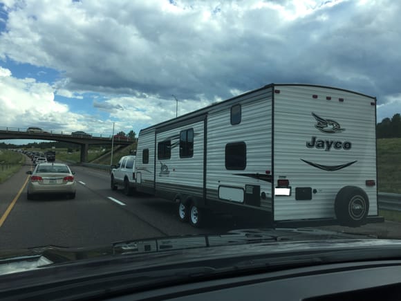 I-25 south of Castle Rock. Nice looking Ex with a big trailer. Even had fire wood in the roof rack. I've seen more Ex's in three hours in Colorado than I do in a week in GA/AL.