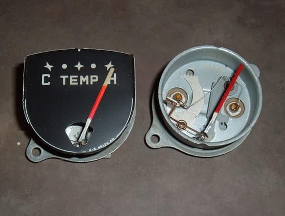 two temp gauges front view - both show about 10 ohms with a meter. I pulled the face off the right one to put on the meter guts from the 89 astro van.