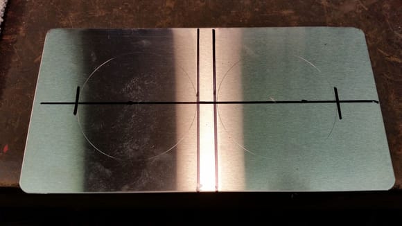 Started with a flat plate (note to self - do NOT use Stainless in the future!!!) and marked out and tried for three hours to make the holes.  Finally a 1 1/2" Knockout punch saved this piece, but oh man, working with stainless is tough.