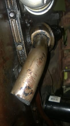 Breather pipe extending from canister beside and underneath of oil pan.  Should plug be fitted to the end of this pipe???