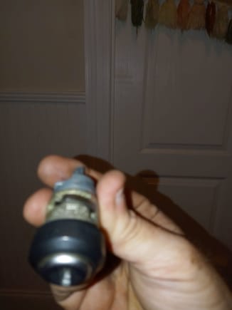 I bought a vw lock and keys 10$.   Even with the top if the key about 1/2" back.  Drill a small 1/8" hole and push the spring down with a tiny jeweler screwdriver.  The whole key section pops out.  Only took off the steering wheel, blinker/wiper handles, and the two covers above and below.   Took 15 minutes.  Starts and all accessories come on!   Nothing worked before as the little push was worn down.  Also watch the little spring it sets in the hole in the housing. 
