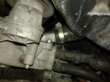 The different clamp was used to tighten the hose around the thermostat  housing