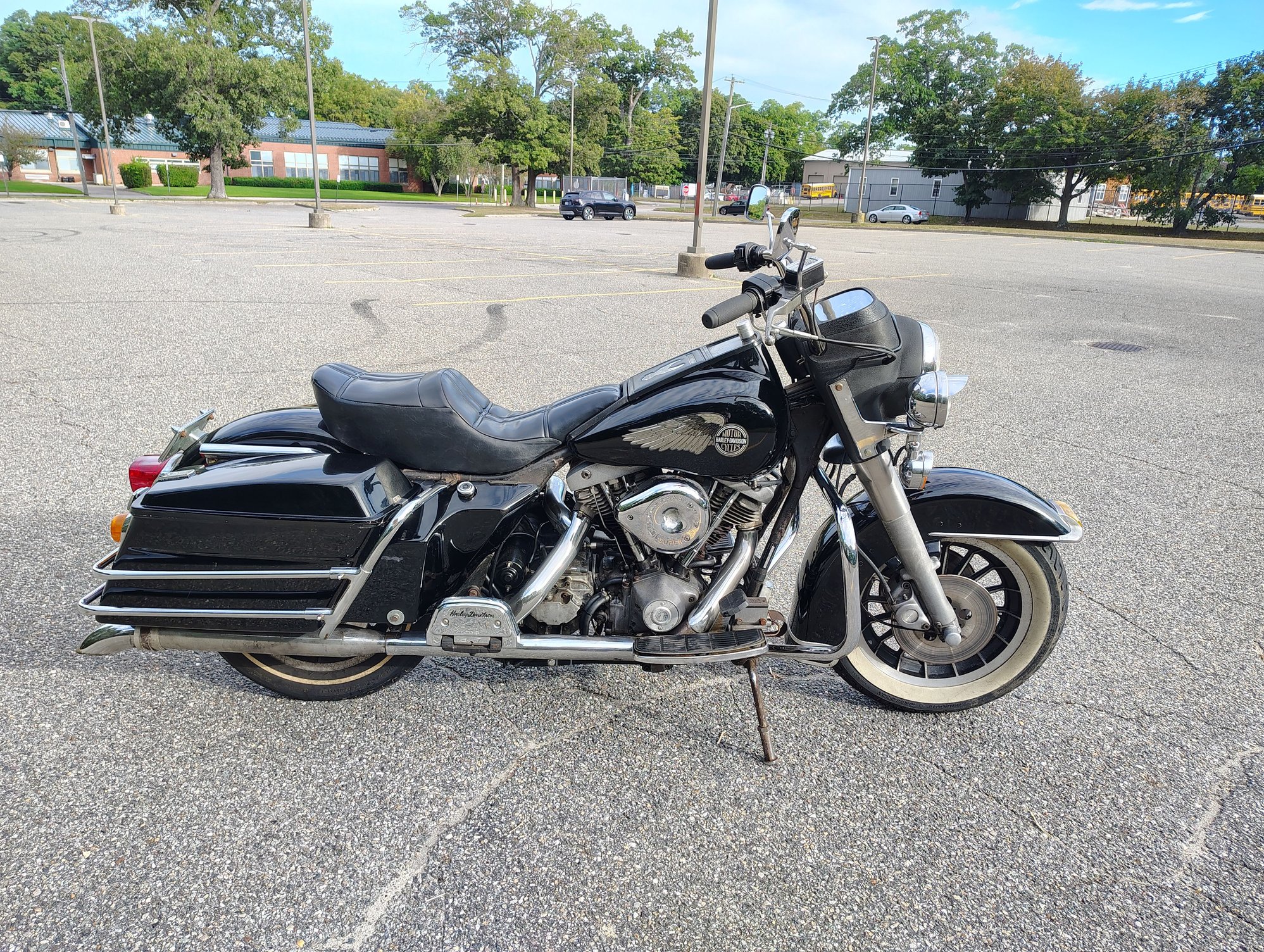 My FLT Tour Glide I bought back in August for $3900. I rode it home 8 miles and didnt die. Barely. It didnt come with a fairing but I was able to score one on ebay thatll need paint for $300. Not sure Im gonna put it on though. I kinda like it the way it is. Seems like it was pretty popular turn them into a road king, basically.