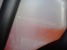 The coolant level has dropped approximately 1/4" in 11,000 miles / 4 months.  This could be due to evaporation.  No leaks found.