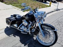 08 Road King Classic  with air ride, 21" front wheel, hooded front light trim rings, front L.E.D headlight and passing lamps. Some recent changes.