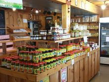 Photo inside the market. Lots of jams, jellies, pickles and sauces.