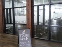 Tour schedule and in the background the wine fermenting for future vintages.
