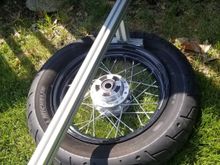 Popped the bead off the old rim with an old piece of aluminum extrusion laying around the garage. Leverage is definitely your friend