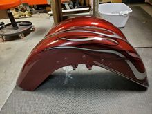 New fender behind the old one: you can see how much bigger the old one is because the back of it is a couple inches longer.