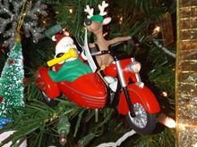 This one is almost 30 years old from Hallmark. If you unplug a christmas light and plug it into the strand the headlight lights up