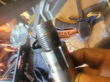 Threads were worn halfway down. Replaced with a new shaft. 