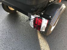 Day 1, on a detour, my wife didn’t stop fast enough and took out my right trailer light. Nothing a little duct tape and zip ties couldn’t handle.
Her bike went down with minimal scratch damage