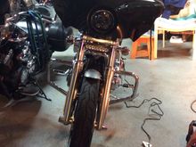 I used fork mount brackets, bought off eBay. Cheap light bar eBay as well