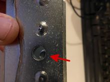 The threaded rod/handle does not align with the hole.