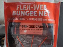 Picked this up at Daytona Bike week.  I plan to use it for my soft bag that goes on top of my TP luggage rack. I can see it holding your helmet securley, just get the correct size.