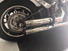 The S&S slip-on mufflers are 100% compliant and won't affect your warranty.  I like them because the shorter length makes checking the rear tire pressure easier.