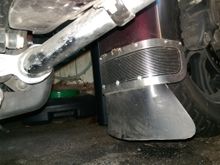 Mine, I curved a 5" piece of 5/8" x 1/16" stainless I had around to go on the inside, so the flap is sandwiched between it and the stock trim piece.  I forgot where I got the flap, it's for a rear fender.I trimmed it up a lot.  No, it's not normally quite that dirty, that was after driving three days  of crappy riding following the remnants of a hurricane.