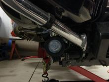 The lights are mounted on the floorboards.