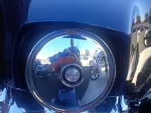 Close up of chrome plate in place of a glass fixture.