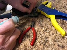 Soldering connections.