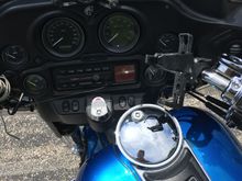 I have an iPhone 6 Plus that I mount in the x-grip mount on its side, with the charge port on the left. You can see how the charge cable is wrapped around the handlebar.